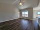 Spacious living room featuring wood floors, natural light, and open floor plan at 181 Norris Ln, Loris, SC 29569
