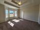 Spacious main bedroom with ceiling fan, plenty of natural light and neutral carpet at 181 Norris Ln, Loris, SC 29569