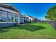 Spacious backyard featuring lush green grass and a fence, offering privacy and a view of neighboring properties at 1903 Francis Ct., Myrtle Beach, SC 29577