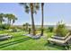 Relaxing beachside lounge area with lounge chairs and palm trees at 201 74Th Ave. N # 707, Myrtle Beach, SC 29572