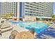 Large outdoor pool with sun loungers and tables near the resort at 201 74Th Ave. N # 707, Myrtle Beach, SC 29572
