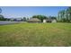 Wide backyard, neighboring houses, fence and mature trees at 2080 Highway 915, Loris, SC 29569