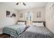 Cozy bedroom featuring two beds, stylish decor, and a ceiling fan at 2080 Highway 915, Loris, SC 29569