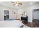 This bedroom features a walk-in closet, an ensuite bathroom, and a dark wood floor at 2080 Highway 915, Loris, SC 29569
