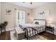 Charming bedroom with a patterned rug, a cozy bed, and a window offering outdoor views at 2080 Highway 915, Loris, SC 29569