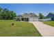 Well-maintained single-story home with a lush green lawn and an extended driveway at 2080 Highway 915, Loris, SC 29569