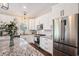 Bright kitchen featuring white cabinetry, stainless steel appliances, and a granite countertop island at 2080 Highway 915, Loris, SC 29569