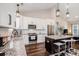 Modern kitchen with white cabinets, stainless steel appliances, and a granite island at 2080 Highway 915, Loris, SC 29569