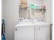 Functional laundry room with washer, dryer, and storage shelves at 2080 Highway 915, Loris, SC 29569