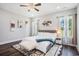 Comfortable main bedroom with hardwood floors, natural light, and neutral decor at 2080 Highway 915, Loris, SC 29569