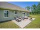Outdoor patio with furniture, fire pit and backyard view at 2080 Highway 915, Loris, SC 29569