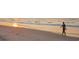 Personal is walking along the beach where the waves meet the sand at sunset at 213 Westleton Dr. # 16-D, Myrtle Beach, SC 29572