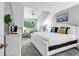 Bright bedroom featuring a white bed frame, ceiling fan, and cozy sitting area at 213 Westleton Dr. # 16-D, Myrtle Beach, SC 29572