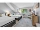 Bright bedroom features two beds, neutral colors, and unique decor at 213 Westleton Dr. # 16-D, Myrtle Beach, SC 29572