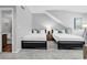 Bedroom with twin beds, stylish furniture, and an adjoining bathroom at 213 Westleton Dr. # 16-D, Myrtle Beach, SC 29572
