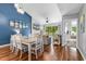 Bright dining area adjacent to a living room is ideal for gatherings with a dining table set for six at 213 Westleton Dr. # 16-D, Myrtle Beach, SC 29572