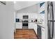 Updated kitchen with white cabinets, stainless steel appliances, and sleek countertops for cooking convenience at 213 Westleton Dr. # 16-D, Myrtle Beach, SC 29572