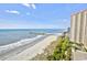 Breathtaking aerial view showcases the expansive ocean, sandy beach, and the community's prime beachfront location at 213 Westleton Dr. # 16-D, Myrtle Beach, SC 29572