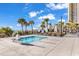 Enjoy a relaxing dip in the outdoor pool with sun loungers and well-maintained landscaping at 213 Westleton Dr. # 16-D, Myrtle Beach, SC 29572