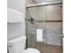 Tiled shower stall featuring a built-in shower caddy and a glass door at 213 Westleton Dr. # 16-D, Myrtle Beach, SC 29572