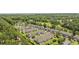 Aerial view of a charming condo community with manicured lawns, pond, and golf course views at 2150 Longwood Lakes Dr. # 2150, Myrtle Beach, SC 29579