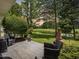 Relaxing backyard featuring a patio with chairs overlooking a lush pond and golf course at 2150 Longwood Lakes Dr. # 2150, Myrtle Beach, SC 29579