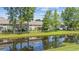 Back of condo overlooking a well maintained yard and a tranquil pond at 2150 Longwood Lakes Dr. # 2150, Myrtle Beach, SC 29579