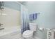 Bathroom showcasing a tub-shower and modern fixtures against blue walls at 2150 Longwood Lakes Dr. # 2150, Myrtle Beach, SC 29579
