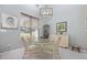 Sunlit dining room with view to the outside and a modern chandelier at 2150 Longwood Lakes Dr. # 2150, Myrtle Beach, SC 29579