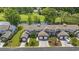 Exterior view of condo with attached garage, well-maintained lawn, and beautiful landscaping at 2150 Longwood Lakes Dr. # 2150, Myrtle Beach, SC 29579
