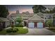 Charming townhome with a well-manicured lawn, brick accents, and a two-car garage at 2150 Longwood Lakes Dr. # 2150, Myrtle Beach, SC 29579