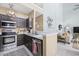 Modern kitchen featuring stainless steel appliances, dark cabinets, and a bar height counter at 2150 Longwood Lakes Dr. # 2150, Myrtle Beach, SC 29579