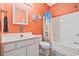 Well-lit bathroom featuring a shower-tub combo, mirror, and decor at 22 Ocean Blvd. N, Surfside Beach, SC 29575