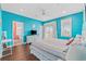 Bright bedroom with wood floors, a ceiling fan, and an ensuite bathroom at 22 Ocean Blvd. N, Surfside Beach, SC 29575