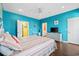 Bright Primary bedroom with wood floors, ceiling fan, and ensuite bathroom at 22 Ocean Blvd. N, Surfside Beach, SC 29575