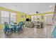 Open-concept living room with dining area, tile floors, and comfortable seating arrangement at 22 Ocean Blvd. N, Surfside Beach, SC 29575