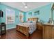 Cozy main bedroom featuring a wooden bed frame, matching nightstands, and natural light from the windows at 22 Ocean Blvd. N, Surfside Beach, SC 29575