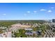 Property aerial view features a wooded area, parking, and surrounding residential area with nearby buildings at 223 Maison Dr. # 14D, Myrtle Beach, SC 29572