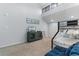 Well-lit room featuring a bunk bed, cabinet, television, carpeted floor, and high ceiling at 223 Maison Dr. # 14D, Myrtle Beach, SC 29572