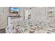 Bedroom features a queen-size bed with seaside themed bedspread and a TV at 223 Maison Dr. # 14D, Myrtle Beach, SC 29572
