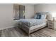 Comfortable bedroom with a large window and light wood-look flooring, creating a relaxing atmosphere at 223 Maison Dr. # 14D, Myrtle Beach, SC 29572