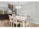 Dining room showcases wood-look floors and an eye-catching spiral staircase at 223 Maison Dr. # 14D, Myrtle Beach, SC 29572