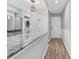 Bright kitchen with marble countertops, stainless steel appliances, and a washer and dryer at 223 Maison Dr. # 14D, Myrtle Beach, SC 29572