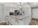 Spacious open kitchen with marble countertops, white cabinets, and modern lighting at 223 Maison Dr. # 14D, Myrtle Beach, SC 29572
