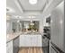Open concept kitchen with a spiral staircase leading to the upper level at 223 Maison Dr. # 14D, Myrtle Beach, SC 29572