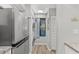 Well-lit laundry area with stainless steel washer, dryer, and ample storage at 223 Maison Dr. # 14D, Myrtle Beach, SC 29572