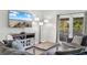 Comfortable living room features a sectional sofa and an outdoor patio at 223 Maison Dr. # 14D, Myrtle Beach, SC 29572