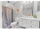 Well-lit bathroom features a shower-tub combo, white vanity, and modern fixtures at 223 Maison Dr. # C-13, Myrtle Beach, SC 29572