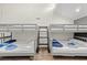 Bunk room with vaulted ceilings and several twin size beds at 223 Maison Dr. # C-13, Myrtle Beach, SC 29572