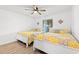 Bedroom featuring hardwood floors, ceiling fan, and two twin-sized beds at 223 Maison Dr. # C-13, Myrtle Beach, SC 29572